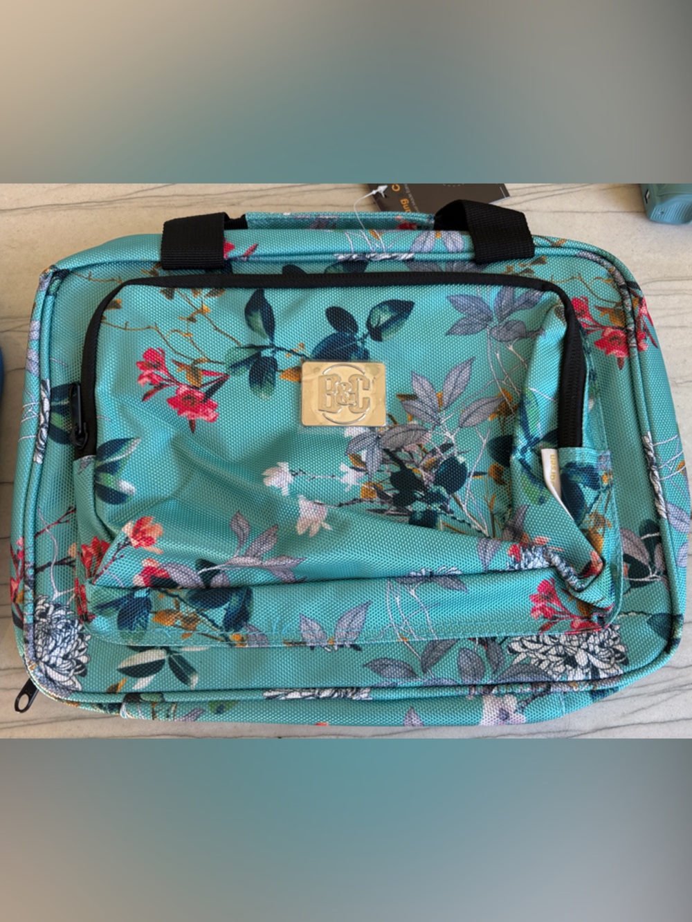 Blue Floral Toiletry bag. Lots of pockets. Can be hung up.
